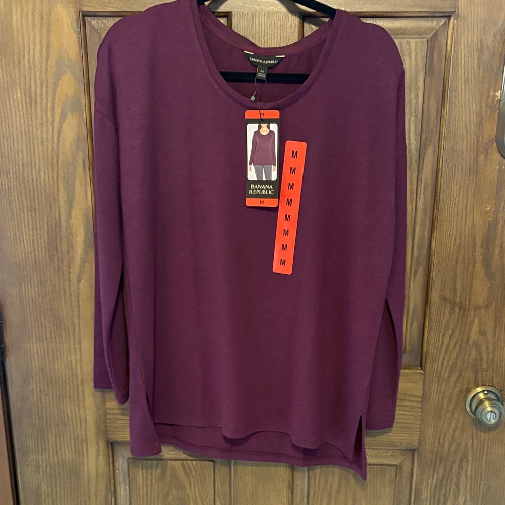 This tunic top runs a little on the large size for a medium.